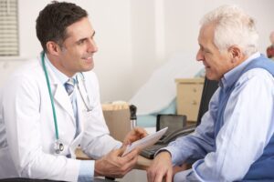 older man talking with his doctor