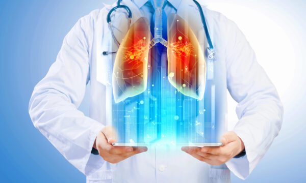 Doctor holding illustration of lungs
